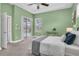 Bedroom with ensuite and sliding glass doors leading to a screened lanai and private pool at 1709 Nodding Thistle Dr, New Port Richey, FL 34655
