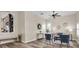 Comfortable living room featuring wood floors, a ceiling fan, and neutral wall color at 1709 Nodding Thistle Dr, New Port Richey, FL 34655