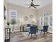 This bright living room features decor and an abundance of natural light at 1709 Nodding Thistle Dr, New Port Richey, FL 34655