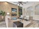 Inviting living room features a fireplace, built-in shelves, and easy access to the entry at 1709 Nodding Thistle Dr, New Port Richey, FL 34655