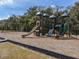 View of a playground with a swing set, slides, and climbing apparatuses at 1709 Nodding Thistle Dr, New Port Richey, FL 34655
