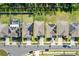 Aerial view of homes featuring well-maintained lawns, driveways, and some with solar panels at 1957 Fan Aloe Way, Ruskin, FL 33570