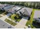 Aerial view showcasing the property, neighboring homes, and verdant surrounding landscape at 1957 Fan Aloe Way, Ruskin, FL 33570