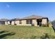 Backyard view of home, featuring ample greenspace at 1957 Fan Aloe Way, Ruskin, FL 33570