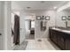 Well-designed bathroom with a double vanity, granite countertop, and a separate shower at 1957 Fan Aloe Way, Ruskin, FL 33570