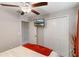 Bright, carpeted bedroom with closet, television and ceiling fan at 1957 Fan Aloe Way, Ruskin, FL 33570