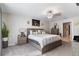 This inviting bedroom features a king-size bed, soothing decor, and bedside lighting at 1957 Fan Aloe Way, Ruskin, FL 33570