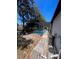 Expansive backyard featuring a screened-in pool and mature trees at 2335 Canfield Dr, Spring Hill, FL 34609