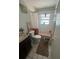 Modest bathroom with a vanity, toilet, and shower/tub combo at 2335 Canfield Dr, Spring Hill, FL 34609
