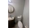 Cozy bathroom featuring a tiled floor, vanity with sink, and toilet at 2335 Canfield Dr, Spring Hill, FL 34609