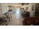 Open-concept room with view of kitchen and a dining space at 2335 Canfield Dr, Spring Hill, FL 34609