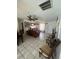 Open-concept living room area with lots of space, tile flooring, and overhead lighting at 2335 Canfield Dr, Spring Hill, FL 34609