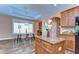 Open dining area with modern lighting and kitchen island at 2506 W Ivy St, Tampa, FL 33607