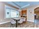 Dining room with wood floors, modern lighting, and wet bar at 2506 W Ivy St, Tampa, FL 33607