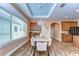 Dining room with wood floors, modern lighting, and wet bar at 2506 W Ivy St, Tampa, FL 33607