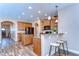 Eat-in kitchen features wooden cabinets, granite countertops, pendant lighting, and a breakfast bar at 2506 W Ivy St, Tampa, FL 33607