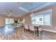 Open-concept living room with wood flooring and ample natural light at 2506 W Ivy St, Tampa, FL 33607