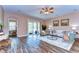 Bright living room with modern decor, wood floors, and sliding glass doors leading to the patio at 2506 W Ivy St, Tampa, FL 33607