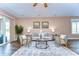 Cozy living room featuring modern decor, wood floors, and sliding glass doors leading to the patio at 2506 W Ivy St, Tampa, FL 33607