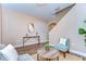 Bright and airy living room with hardwood floors, modern console table and a staircase at 2506 W Ivy St, Tampa, FL 33607