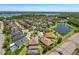 Wide aerial view showcasing neighborhood, homes, lakes, and community layout at 2630 Milford Berry Ln, Tampa, FL 33618