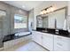 Relaxing bathroom with soaking tub, glass shower, and spacious countertops at 2630 Milford Berry Ln, Tampa, FL 33618