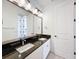 Beautiful bathroom with granite countertops, double sinks, and a stylish mirror at 2630 Milford Berry Ln, Tampa, FL 33618