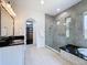 Gorgeous bathroom with glass shower, soaking tub, and walk-in closet at 2630 Milford Berry Ln, Tampa, FL 33618