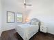 Bedroom featuring a plush bed, modern ceiling fan, and bedside tables, creating a welcoming and relaxing atmosphere at 2630 Milford Berry Ln, Tampa, FL 33618