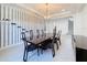Dining area boasts wine rack, modern chandelier, and a table with seating for six people at 2630 Milford Berry Ln, Tampa, FL 33618
