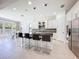 Bright, open kitchen with center island, modern appliances, and adjacent dining area at 2630 Milford Berry Ln, Tampa, FL 33618