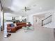 Spacious living room with tile flooring, neutral walls, a leather couch and an open floor plan at 2630 Milford Berry Ln, Tampa, FL 33618