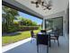 Outdoor patio with ceiling fan, dining table, and view of the backyard at 2630 Milford Berry Ln, Tampa, FL 33618