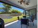 Outdoor patio with ceiling fan, dining table, grill and screen at 2630 Milford Berry Ln, Tampa, FL 33618