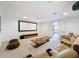 Spacious theater room with a large screen, comfortable seating, and modern entertainment center at 2630 Milford Berry Ln, Tampa, FL 33618
