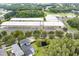 Aerial view showcasing Longleaf Elementary School, offering modern facilities and ample parking in a serene, wooded setting at 3465 Bumelia Ln, New Port Richey, FL 34655