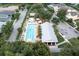Aerial view of the community pool and clubhouse, offering a refreshing escape and social hub for residents at 3465 Bumelia Ln, New Port Richey, FL 34655