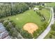 A charming neighborhood featuring a large open recreational space with a softball diamond, and multiple soccer fields at 3465 Bumelia Ln, New Port Richey, FL 34655