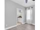 Neutral bedroom leading into bathroom at 3465 Bumelia Ln, New Port Richey, FL 34655