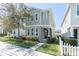 Charming two-story home featuring a well-manicured lawn, beautiful landscaping, and a welcoming front entrance at 3465 Bumelia Ln, New Port Richey, FL 34655