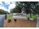 Longleaf Elementary School sign, a Florida Arts Model School, nestled among trees on a sunny day at 3465 Bumelia Ln, New Port Richey, FL 34655