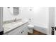 This bathroom is bright and clean, with a granite countertop vanity and subway tile at 3592 Arrowhead Ave, Spring Hill, FL 34606