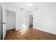 This bedroom features a closet, neutral paint, and flows to another room at 3592 Arrowhead Ave, Spring Hill, FL 34606