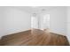 This bedroom has vinyl floors, neutral paint, and flows to the ensuite bathroom at 3592 Arrowhead Ave, Spring Hill, FL 34606