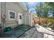 Backyard view showing a home entrance surrounded by steps and a stone paver patio with wood fence at 4725 3Rd S Ave, St Petersburg, FL 33711