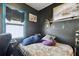 A bedroom with dark walls and window, featuring a cozy bed setup at 4725 3Rd S Ave, St Petersburg, FL 33711