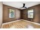This bedroom has laminate flooring and two windows for lots of natural light at 4725 3Rd S Ave, St Petersburg, FL 33711