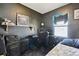 A bedroom with dark walls, speakers, and a desk area for a cool ambiance at 4725 3Rd S Ave, St Petersburg, FL 33711