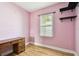 This charming bedroom has lovely laminate floors, natural light, and built in shelves at 4725 3Rd S Ave, St Petersburg, FL 33711