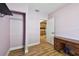 Bedroom with hardwood floors, built-in closet, and access to kitchen at 4725 3Rd S Ave, St Petersburg, FL 33711